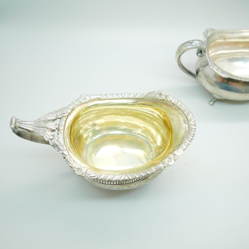 832 - A 19th Century silver cream jug and an early 20th Century silver sugar bowl, worn Birmingham and Che... 