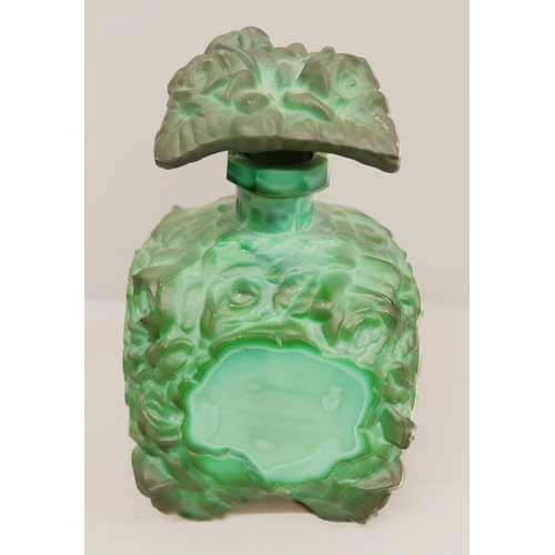 837 - In the manner of Heinrich Hoffmann; seven items of malachite glass, three vases depicting raised fig... 