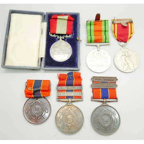 839 - A silver Fire Brigade Long Service medallion, three other Fire Brigade medallions and two other meda... 