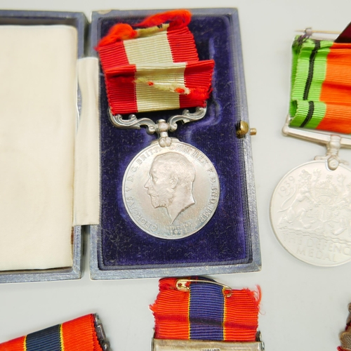 839 - A silver Fire Brigade Long Service medallion, three other Fire Brigade medallions and two other meda... 