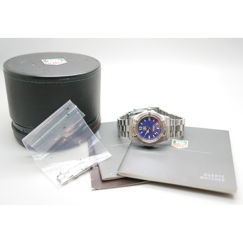 845 - A Tag Heuer wristwatch, with paperwork, box and spare links, 37mm with crown