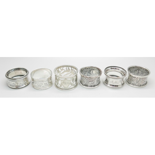 848 - A pair of silver napkin rings, Chester 1911, and four others, 100g