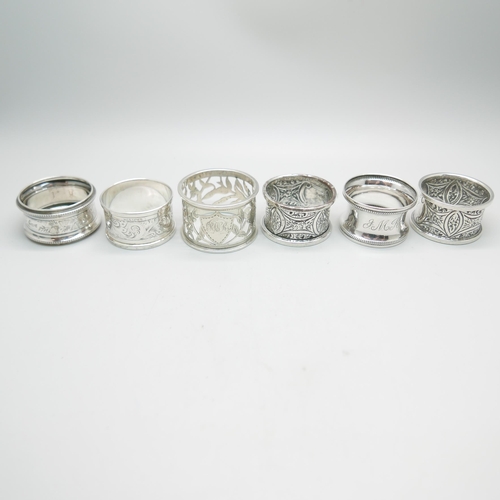 848 - A pair of silver napkin rings, Chester 1911, and four others, 100g