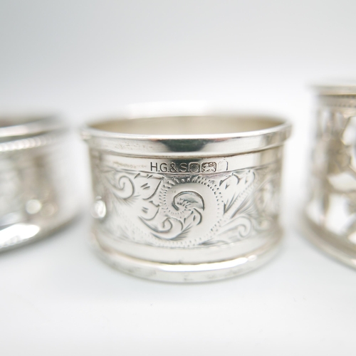 848 - A pair of silver napkin rings, Chester 1911, and four others, 100g