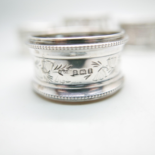 848 - A pair of silver napkin rings, Chester 1911, and four others, 100g