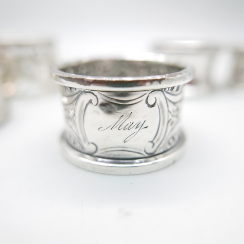 848 - A pair of silver napkin rings, Chester 1911, and four others, 100g