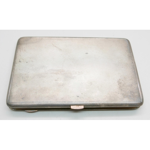 850 - A silver cigarette case with a hallmarked 9ct gold release button and gilt interior, London 1931, Sa... 