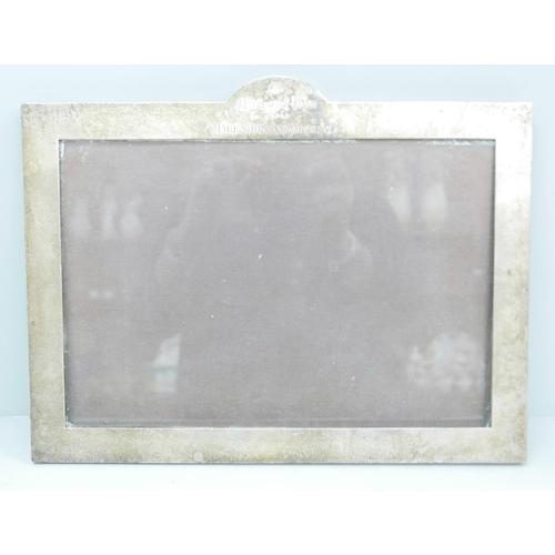 874 - A silver photograph frame with inscription, 25.5cm x 36cm