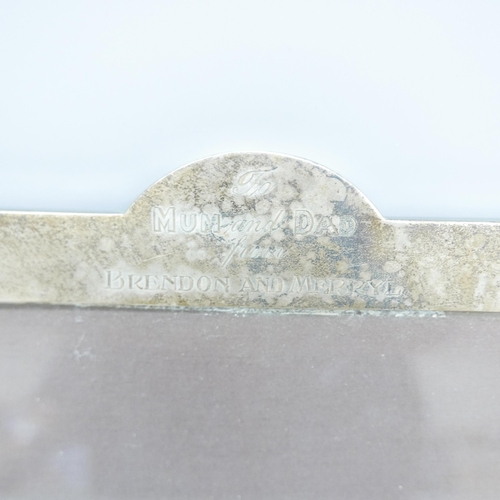 874 - A silver photograph frame with inscription, 25.5cm x 36cm