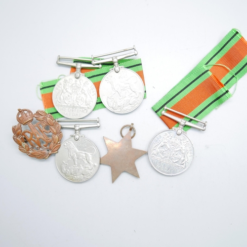 885 - Five WWII medals and a RAF badge