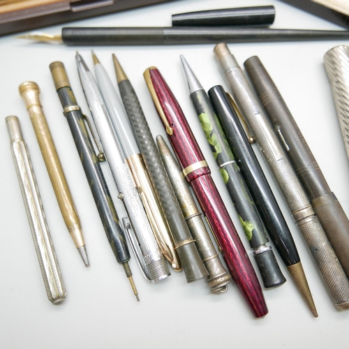 902 - A collection of pens and pencils