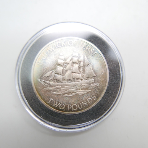 906 - Two commemorative coins in a presentation box; 25th Wedding anniversary silver coins