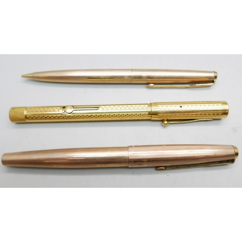 908 - Three gold plated pens, two Parker and a Waterman