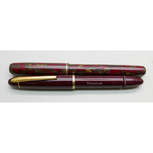 911 - A Waterman marbled fountain pen and a Staedtler bottom filler fountain pen