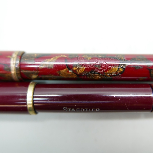 911 - A Waterman marbled fountain pen and a Staedtler bottom filler fountain pen