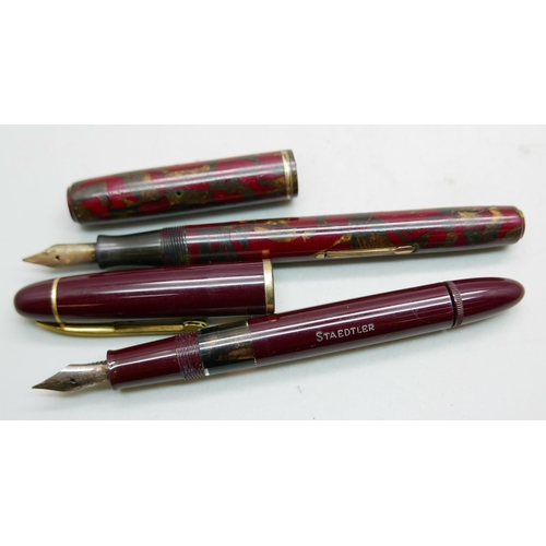 911 - A Waterman marbled fountain pen and a Staedtler bottom filler fountain pen