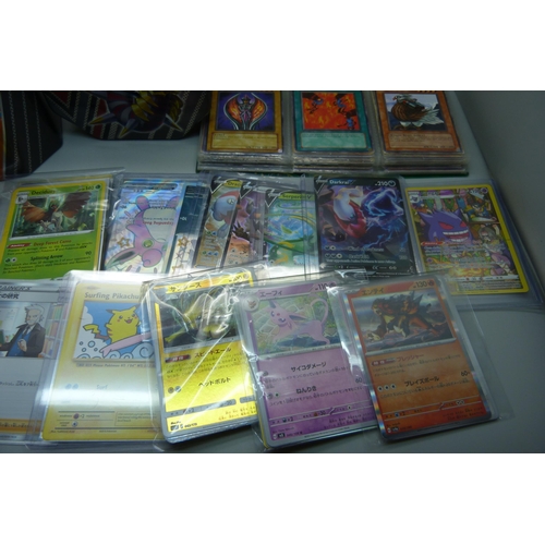 923 - Three boxes of Pokemon Trading Cards including four sealed packs, Japanese issues, many in plastic s... 