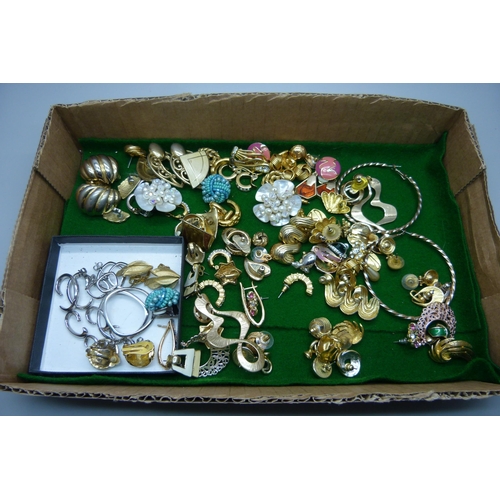 932 - Approximately fifty pairs of costume earrings including Trifari and Fossil