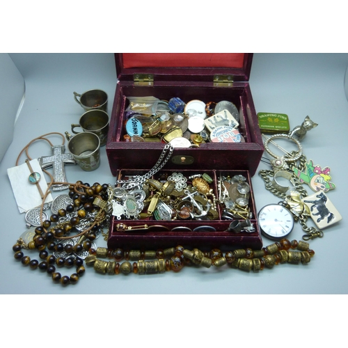 933 - Costume jewellery, badges, etc., and a fob watch marked fine silver