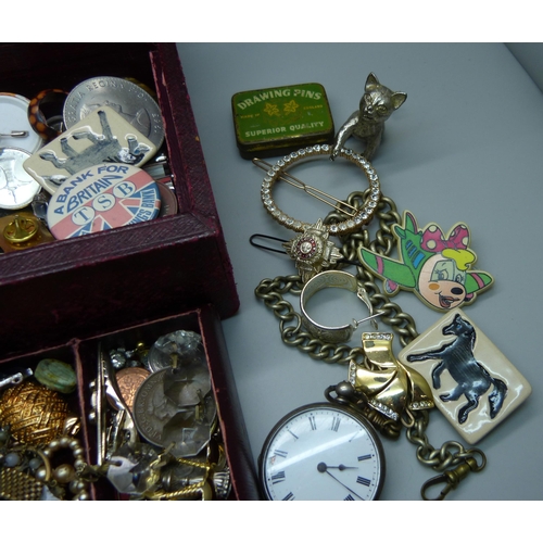 933 - Costume jewellery, badges, etc., and a fob watch marked fine silver