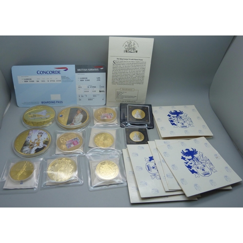 935 - A collection of gold plated commemorative coins and medallions including Concorde with authenticity ... 