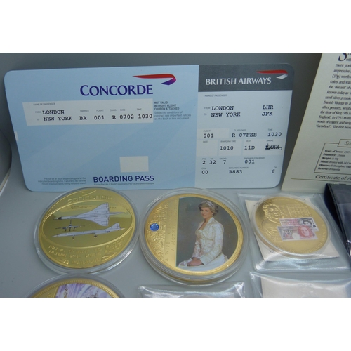 935 - A collection of gold plated commemorative coins and medallions including Concorde with authenticity ... 