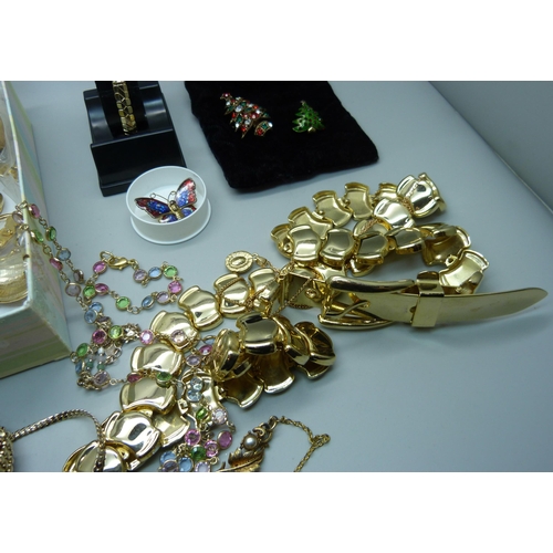 953 - A collection of gold toned jewellery including a Dior brooch, a 9ct gold wristwatch and two Butler a... 