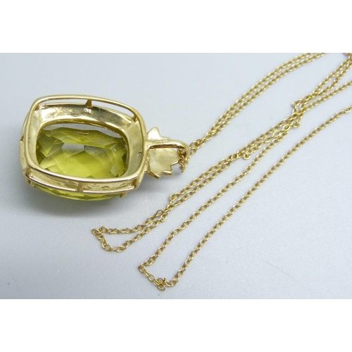 960 - A 9ct gold, scapolite chequerboard cut pendant with diamond accents on a fine 9ct gold chain, 8.8g