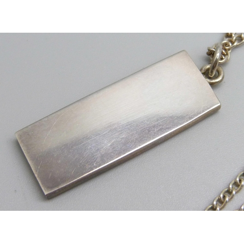 961 - A silver ingot pendant on a silver chain, 23g