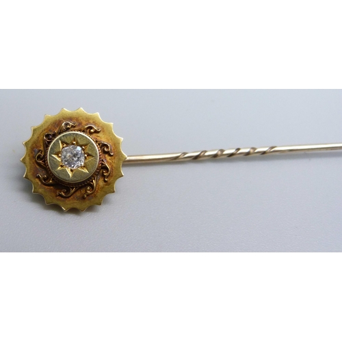 975 - A c1900 diamond set stick pin, 2.6g, top 15mm diameter