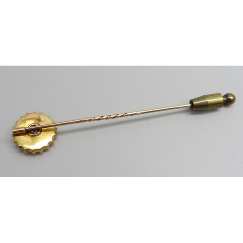 975 - A c1900 diamond set stick pin, 2.6g, top 15mm diameter