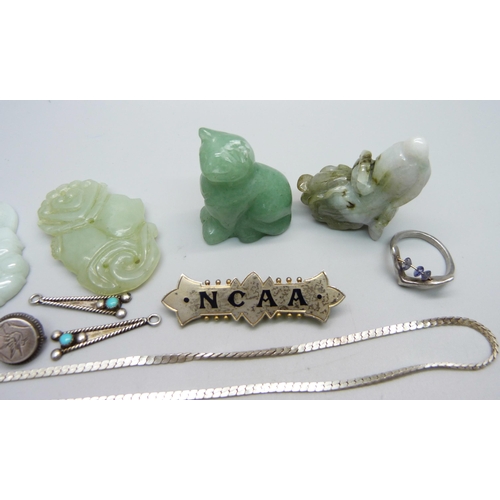 977 - A hallmarked silver brooch, Birmingham 1901, marked NCAA, other silver jewellery, three jade pendant... 