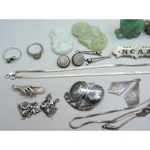 977 - A hallmarked silver brooch, Birmingham 1901, marked NCAA, other silver jewellery, three jade pendant... 