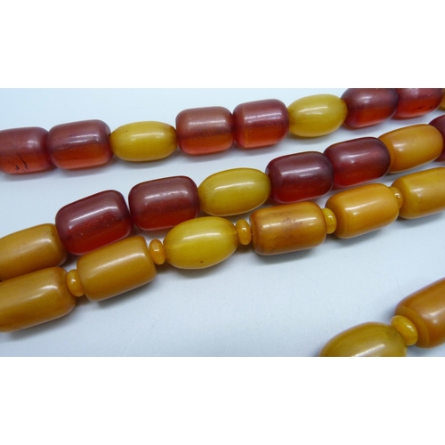 980 - Two amber coloured bead necklaces