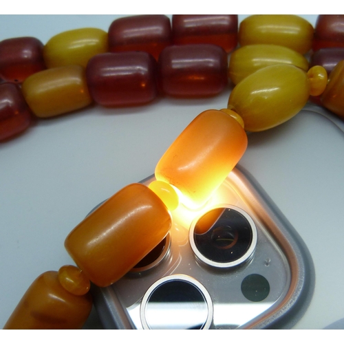 980 - Two amber coloured bead necklaces