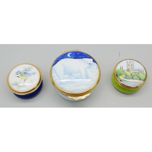 836 - Two Moorcroft enamelled pill boxes, one signed, and one other enamelled pill box