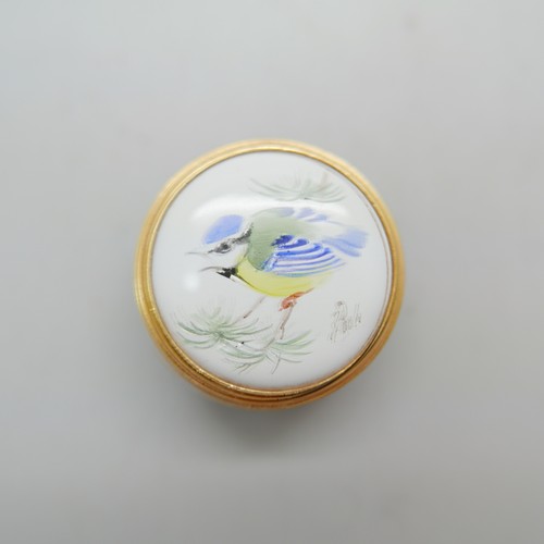 836 - Two Moorcroft enamelled pill boxes, one signed, and one other enamelled pill box