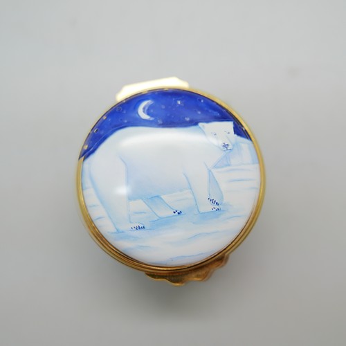 836 - Two Moorcroft enamelled pill boxes, one signed, and one other enamelled pill box