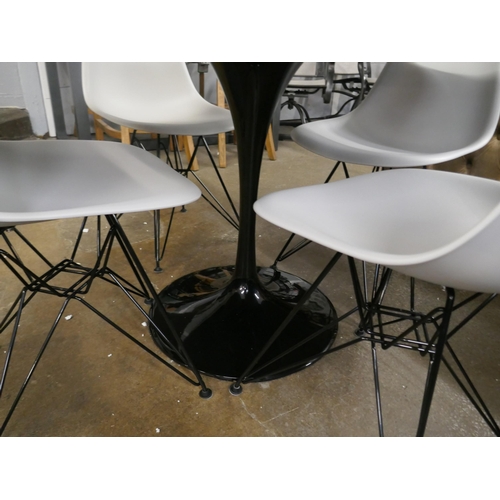 1479 - A Charles and Ray Eames style cast iron based tulip table, 120cm, and four Eiffel chairs in grey wit... 