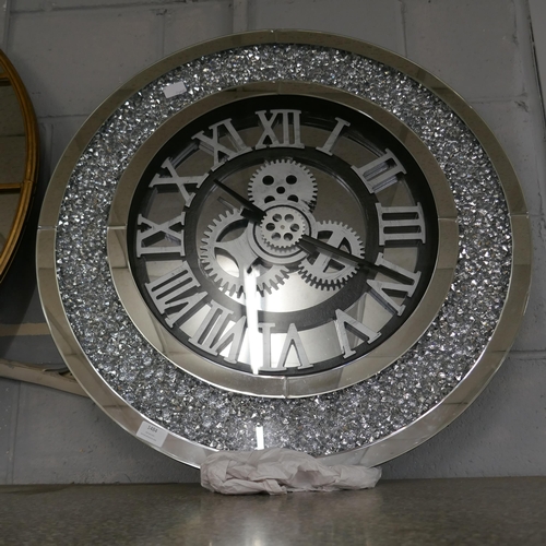 1484 - A mechanical mirrored wall clock, 75cm