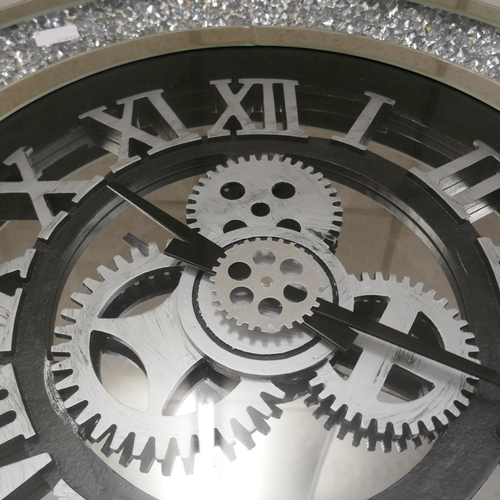 1484 - A mechanical mirrored wall clock, 75cm