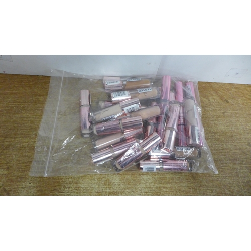 2100 - A bag of approx. 20 assorted Revolution make-up samples * This lot is subject to vat