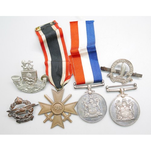 898 - Two South African For War Services Medals, a German Cross medal and three badges