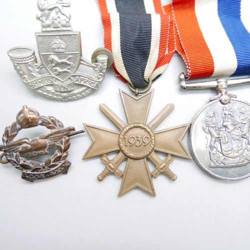 898 - Two South African For War Services Medals, a German Cross medal and three badges