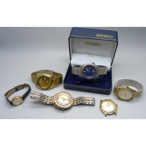 922 - Watches including a Seiko 5 automatic, a Seiko quartz day/date and a lady's Omega