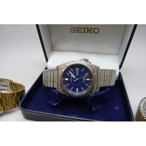 922 - Watches including a Seiko 5 automatic, a Seiko quartz day/date and a lady's Omega