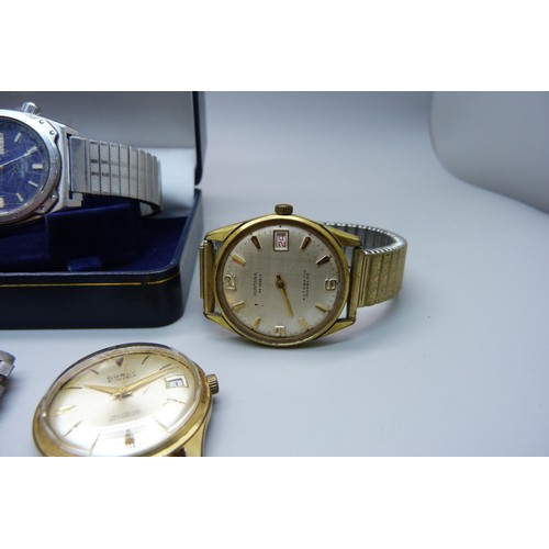 922 - Watches including a Seiko 5 automatic, a Seiko quartz day/date and a lady's Omega