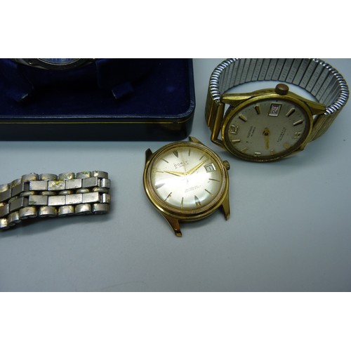 922 - Watches including a Seiko 5 automatic, a Seiko quartz day/date and a lady's Omega