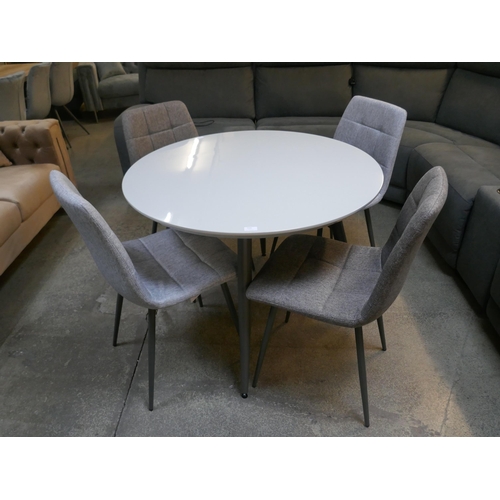 1505 - A Logan circular dining table and four orbit chairs