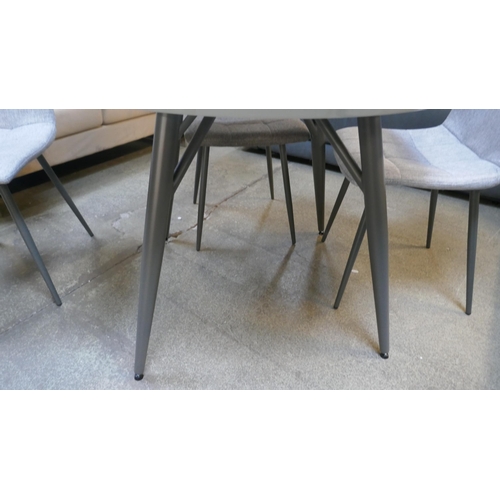 1505 - A Logan circular dining table and four orbit chairs